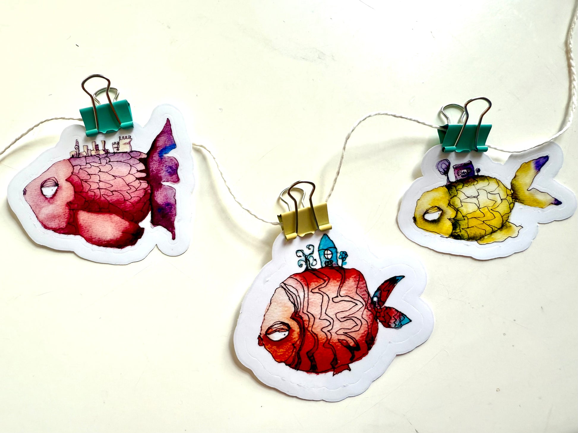 Pack of fishes with towns - from watercolor and ink sketches