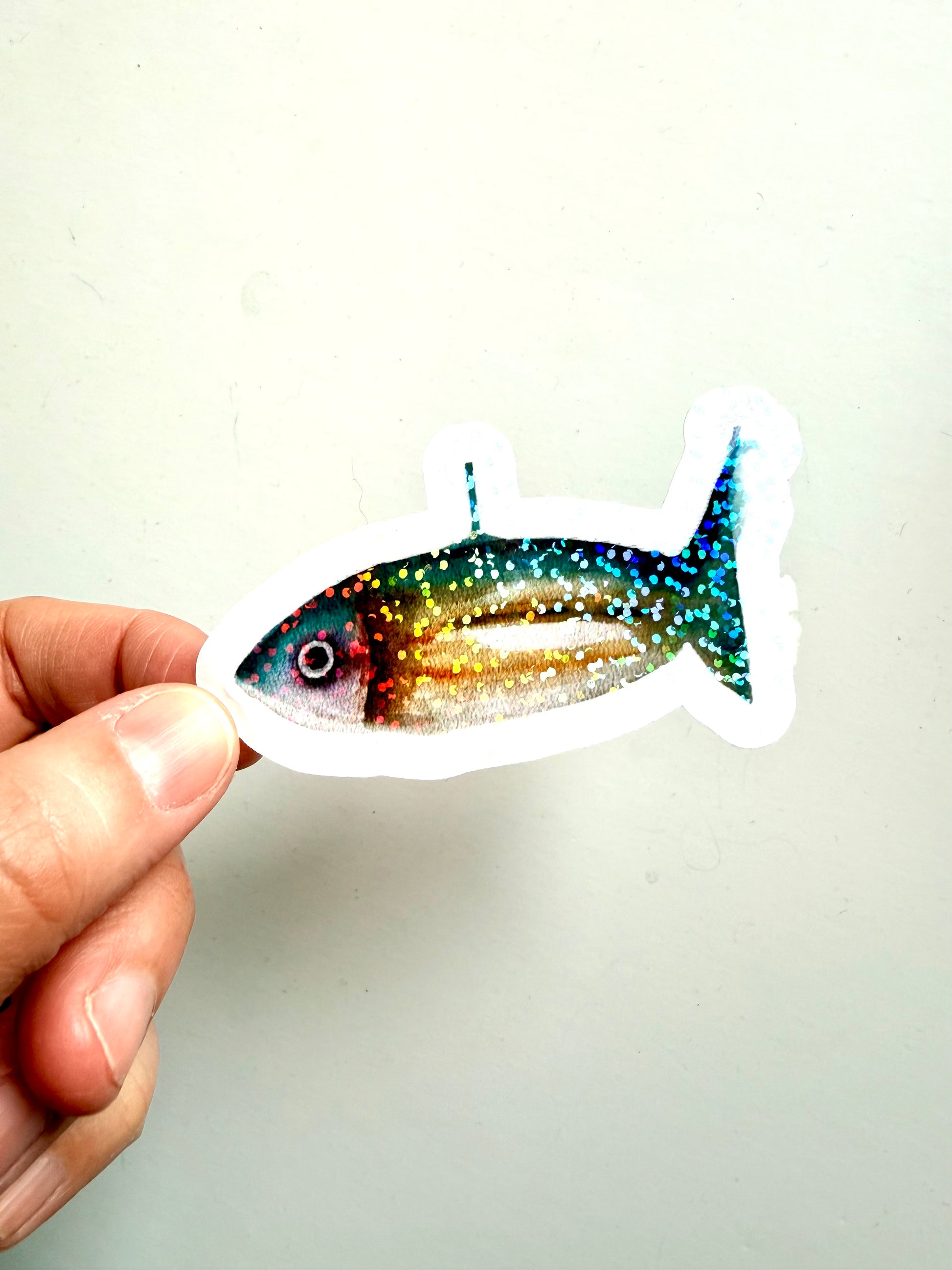 Teal and yellow fish from watercolor sketch